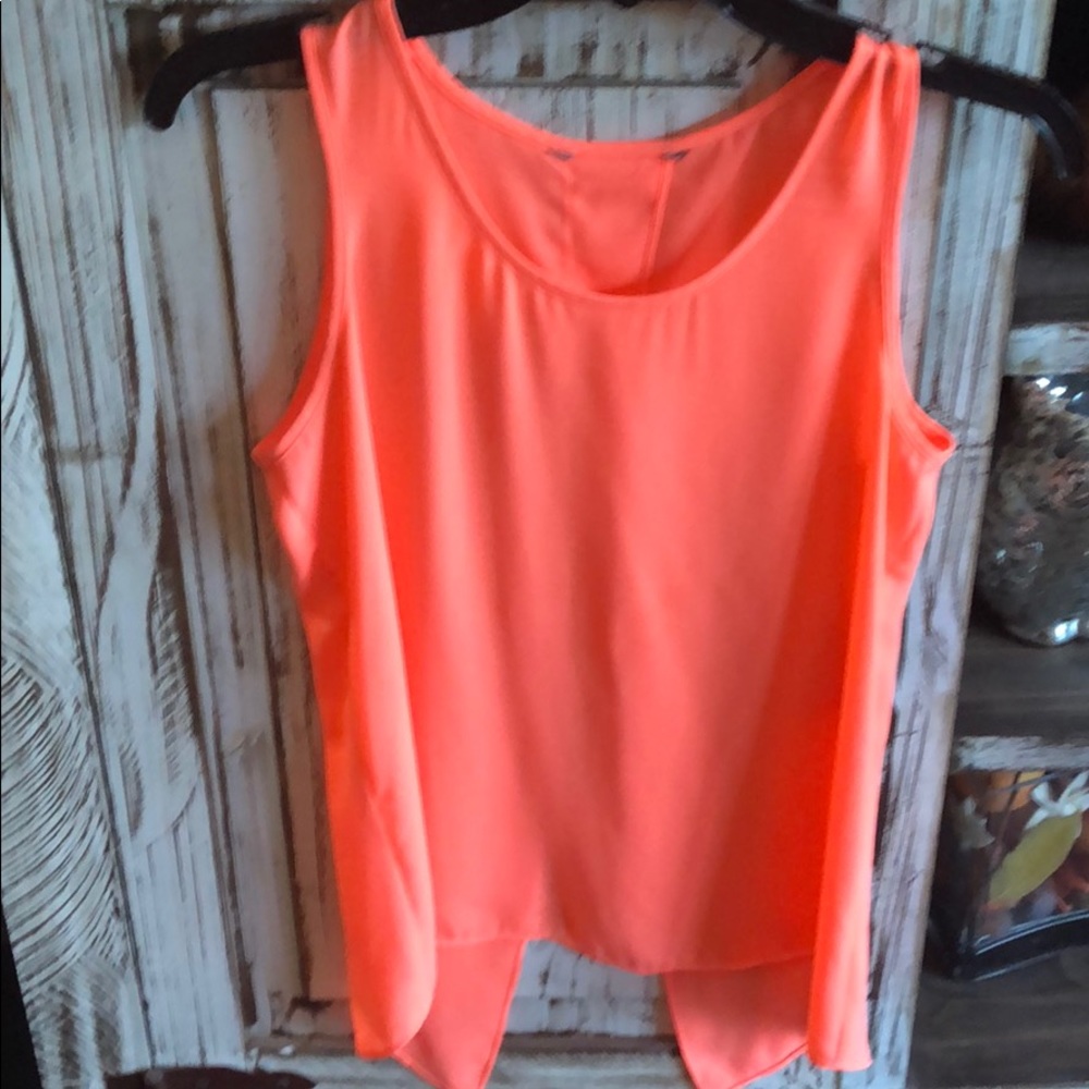 Tangerine tank, flowy open back.